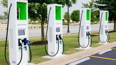 How can IoT help in addressing the challenge of charging stations for EVs in India